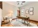 Well-lit office space with hardwood floors, a modern desk, and a comfortable chair at 1012 Fillmore St, Denver, CO 80206