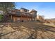 Spacious backyard with a deck and hot tub, ideal for outdoor relaxation and entertainment at 12007 W 54Th Dr, Arvada, CO 80002