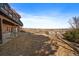 Backyard showcasing a deck, a hot tub, and scenic views of the surrounding neighborhood at 12007 W 54Th Dr, Arvada, CO 80002