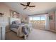 Cozy bedroom with a large window, a comfortable bed, and a great view at 12007 W 54Th Dr, Arvada, CO 80002