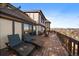 Expansive deck featuring lounge chairs, offering a relaxing outdoor space with scenic views at 12007 W 54Th Dr, Arvada, CO 80002