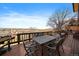 Outdoor deck with seating area and grill overlooking the beautiful neighborhood views at 12007 W 54Th Dr, Arvada, CO 80002