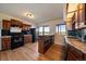 Kitchen featuring modern appliances, plenty of countertop space, and natural light at 12007 W 54Th Dr, Arvada, CO 80002