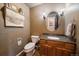 Charming powder room with granite countertop and hardwood floors at 12007 W 54Th Dr, Arvada, CO 80002