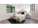 Bright bedroom with large windows, a neutral color palette, and modern decor at 2237 S Madison St, Denver, CO 80210