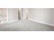 Spacious bedroom featuring neutral paint, soft carpet, and an open doorway leading into the ensuite at 2237 S Madison St, Denver, CO 80210