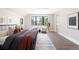 Bright and airy bedroom with large windows, wood floors, and contemporary decor at 2237 S Madison St, Denver, CO 80210