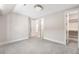 Neutral bedroom with multiple doors, grey carpet, closet, and white trim at 2237 S Madison St, Denver, CO 80210