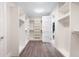 Spacious walk-in closet with custom shelving and hardwood floors for optimal organization at 2237 S Madison St, Denver, CO 80210