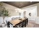 Sophisticated dining area boasts a rustic wooden table, stylish black chairs, and a statement chandelier at 2237 S Madison St, Denver, CO 80210