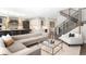 Open concept living space featuring modern furnishings, a staircase, and a bright, airy atmosphere at 2237 S Madison St, Denver, CO 80210