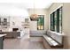 Cozy breakfast nook with custom bench seating, an adjacent fireplace, and an open-concept layout at 2237 S Madison St, Denver, CO 80210