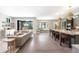 Open concept living area and kitchen with stainless appliances, large island, and sliding glass doors at 2237 S Madison St, Denver, CO 80210