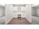 Home office area featuring built-in cabinets, a desk, and hardwood floors at 2237 S Madison St, Denver, CO 80210