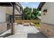 A backyard patio has a fire pit, exposed rafter coverage, and brick pillars with a view of the yard at 2237 S Madison St, Denver, CO 80210
