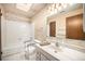 Bathroom featuring a skylight and a combined shower and tub at 6369 W 69Th Ave, Arvada, CO 80003