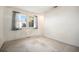 Bedroom featuring wall-to-wall carpet and a window with curtains at 6369 W 69Th Ave, Arvada, CO 80003