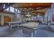 Spacious game room with pool tables and seating areas at 6940 E Girard Ave # 307, Denver, CO 80224