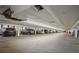 Parking garage featuring multiple parked vehicles at 6940 E Girard Ave # 307, Denver, CO 80224