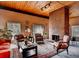 Cozy living room with a brick fireplace and comfortable seating at 6940 E Girard Ave # 307, Denver, CO 80224