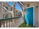 Condo balcony with teal door and view of the complex at 3845 Canyon Ranch Rd # 104, Highlands Ranch, CO 80126