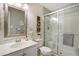 Clean bathroom with walk-in shower and updated vanity at 3845 Canyon Ranch Rd # 104, Highlands Ranch, CO 80126