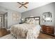 Spacious bedroom with hardwood floors and ensuite bathroom access at 3845 Canyon Ranch Rd # 104, Highlands Ranch, CO 80126