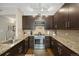 Modern kitchen with granite counters and stainless steel appliances at 3845 Canyon Ranch Rd # 104, Highlands Ranch, CO 80126