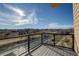 Balcony view overlooking a scenic landscape with clear glass railings and a modern design at 1208 N Quitman St # 405, Denver, CO 80204