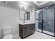 Modern bathroom with stylish vanity, frameless shower, and contemporary fixtures at 1208 N Quitman St # 405, Denver, CO 80204