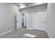 Neutral bedroom features an interior entry door, closet and an en-suite bathroom at 1208 N Quitman St # 405, Denver, CO 80204