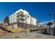 Modern building with private balconies, well-lit stairs, and a nearby bus stop for easy public transport access at 1208 N Quitman St # 405, Denver, CO 80204