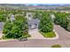 This house sits on a beautifully landscaped lot with mature trees, offering serene views of the mountains at 126 Mc Intyre Circle, Golden, CO 80401
