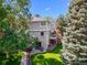 Back of home showcases a landscaped yard, patio, and fenced lawn at 126 Mc Intyre Circle, Golden, CO 80401