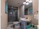 Updated bathroom with glass-enclosed shower, pedestal sink, and modern gray tile at 126 Mc Intyre Circle, Golden, CO 80401