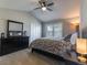 Carpeted bedroom with a ceiling fan and ample natural light from the louvred windows at 126 Mc Intyre Circle, Golden, CO 80401