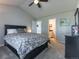 Carpeted bedroom with en-suite bathroom, vaulted ceiling, and ceiling fan at 126 Mc Intyre Circle, Golden, CO 80401
