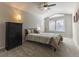 Cozy bedroom featuring vaulted ceilings, ceiling fan, and natural light from a window at 126 Mc Intyre Circle, Golden, CO 80401
