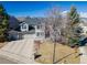 Two-story home with three-car garage, mature trees, and mountain views at 126 Mc Intyre Circle, Golden, CO 80401