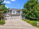 Charming two-story home featuring a three-car garage, beautiful stonework and a well-manicured lawn at 126 Mc Intyre Circle, Golden, CO 80401