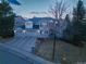 Charming two-story home with a three-car garage and well-maintained front yard landscaping at 126 Mc Intyre Circle, Golden, CO 80401