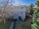 Back of two-story home featuring a walkout basement, patio, and deck overlooking the yard at 126 Mc Intyre Circle, Golden, CO 80401