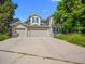 Charming two-story home featuring a three-car garage and well-maintained landscaping at 126 Mc Intyre Circle, Golden, CO 80401
