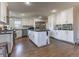 Well-lit modern kitchen boasts stainless steel appliances and white cabinets at 126 Mc Intyre Circle, Golden, CO 80401