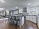 Bright kitchen featuring white cabinets, a center island, and stainless steel appliances at 126 Mc Intyre Circle, Golden, CO 80401