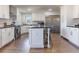 Modern kitchen features a center island with barstool seating and stainless steel appliances at 126 Mc Intyre Circle, Golden, CO 80401