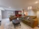 Spacious living room with a wet bar area, a large sofa, chair, and neutral color scheme at 126 Mc Intyre Circle, Golden, CO 80401
