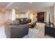 Basement living room with sofa, chair, area rug, dark wood accents, and workout area at 126 Mc Intyre Circle, Golden, CO 80401