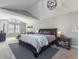 Spacious main bedroom featuring vaulted ceiling, comfortable seating area, and ample natural light at 126 Mc Intyre Circle, Golden, CO 80401