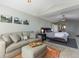 Comfortable main bedroom with sitting area, plush carpeting, and a view into the ensuite bathroom at 126 Mc Intyre Circle, Golden, CO 80401
